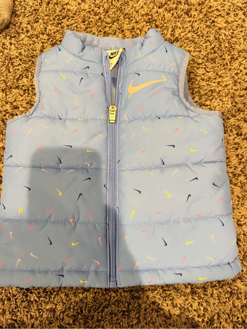 Nike Kids Light Blue Puffer Vest with Multicolor Swooshes
